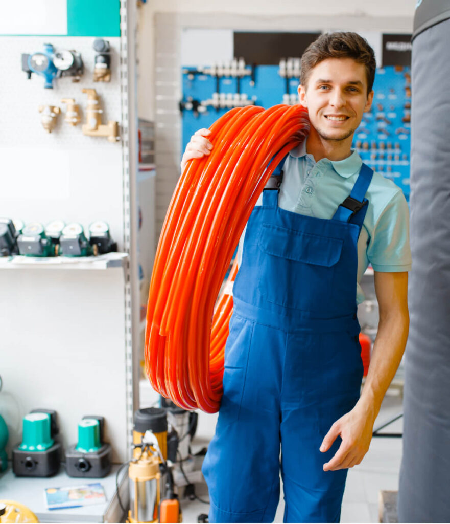 Plumber Holds Pipe Roll